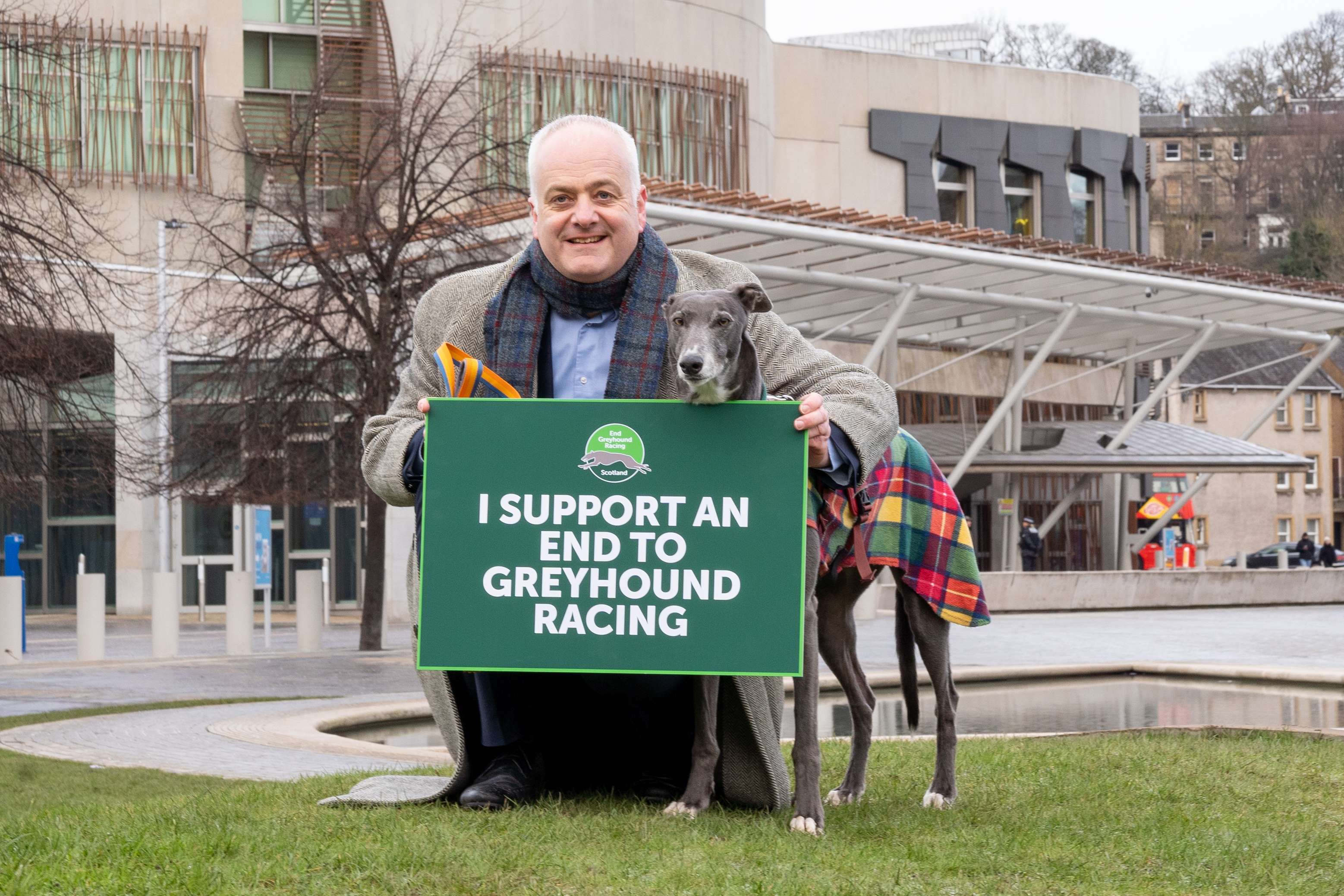 Mark Ruskell MSP and Bluesy the Greyhound outside the Scottish Parliament