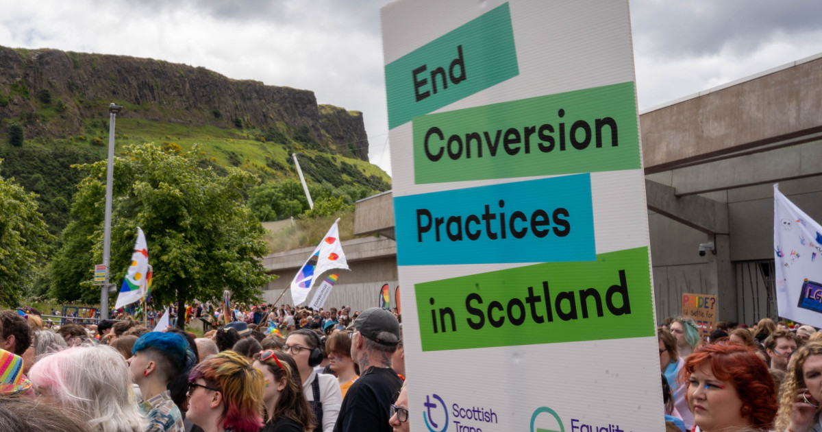 Sign calling for an end to conversion practices at Edinburgh Pride 2024 outside Scottish Parliament