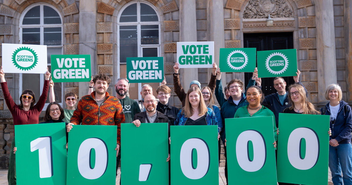 Scottish Greens candidates and members gathering at Langside Halls in Glasgow to celebrate record high membership numbers Scottish Greens candidates and members gathering at Langside Halls in Glasgow to celebrate record high membership numbers with 10k placard