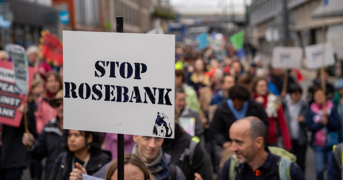 A Stop Rosebank sign help up during a climate march
