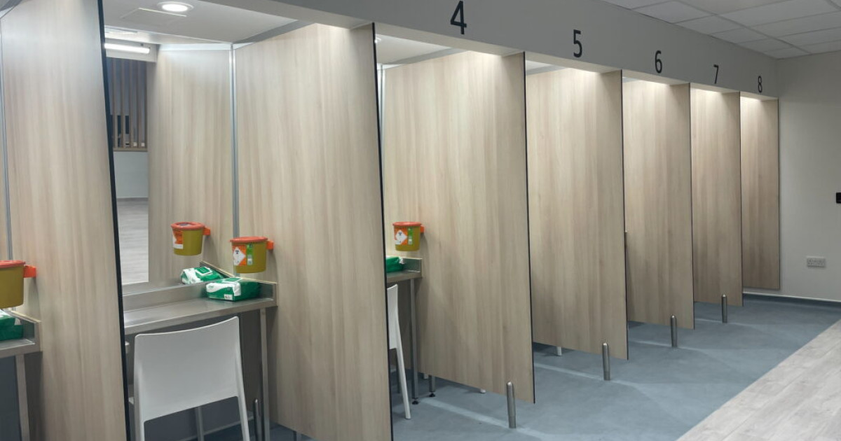 cubicles containing sharps bins and antibacterial wipes at safe consumption room in Glasgow 